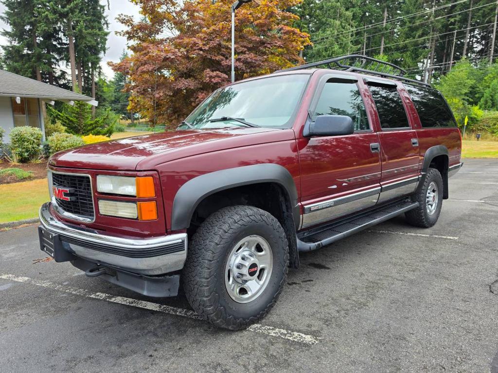 Red (Burgundy) 1999 GMC Suburban SUV / Crossover Four-Wheel Drive 4-Speed Automatic