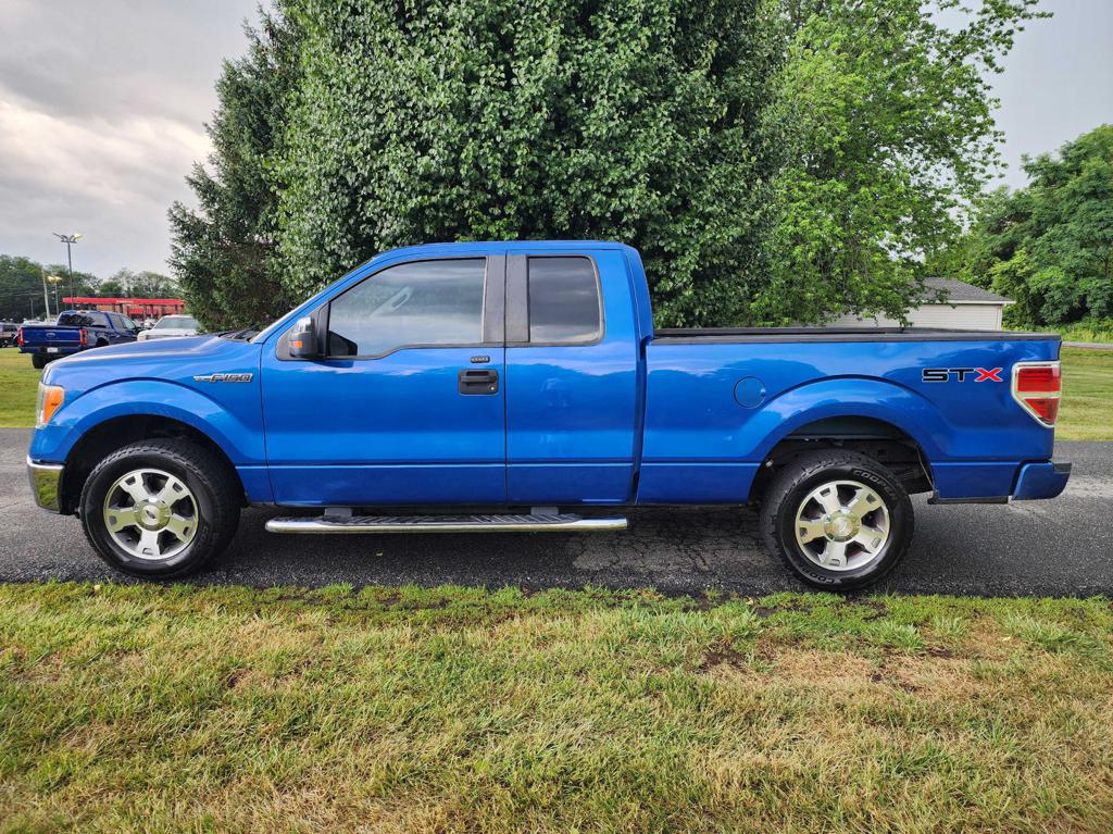 Blue 2010 Ford F-150 STX SuperCab Pickup Truck 4X2 4-Speed Automatic